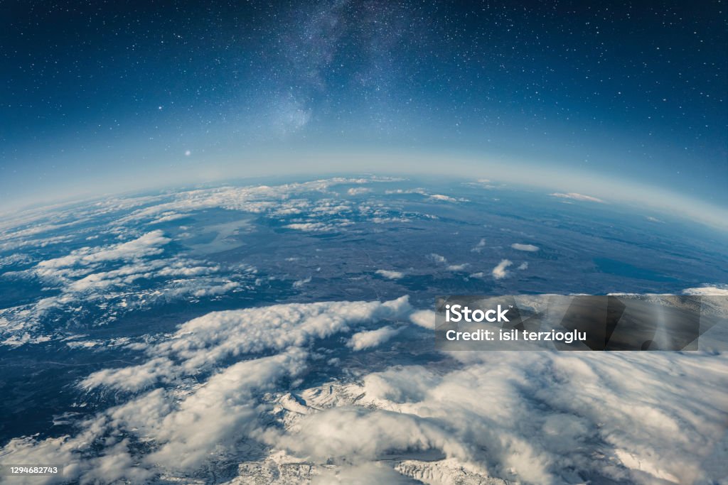 View of stars and milkyway above Earth from space Beautiful space view of the Earth with cloud formation Globe - Navigational Equipment Stock Photo