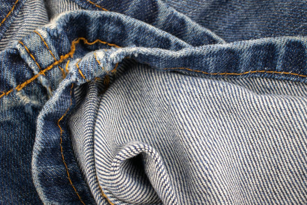 istock blue denim fabric with visible details. textura or background 1294686418