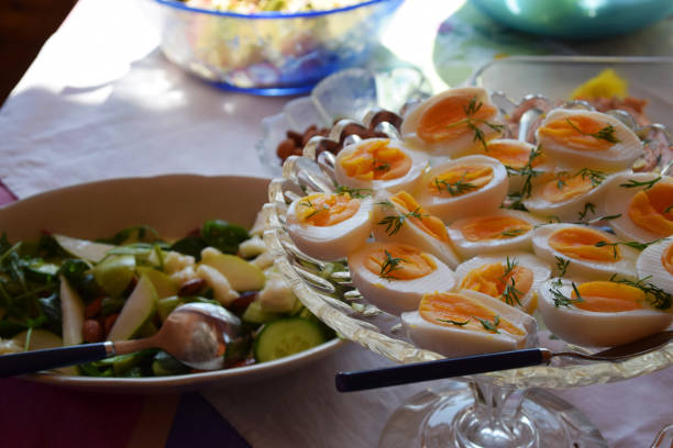 Healthy food with a buffet table with boiled eggs, vegetables and salads.
