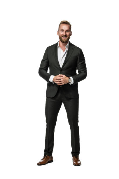 istock Smiling businessman in green suit 1294700489