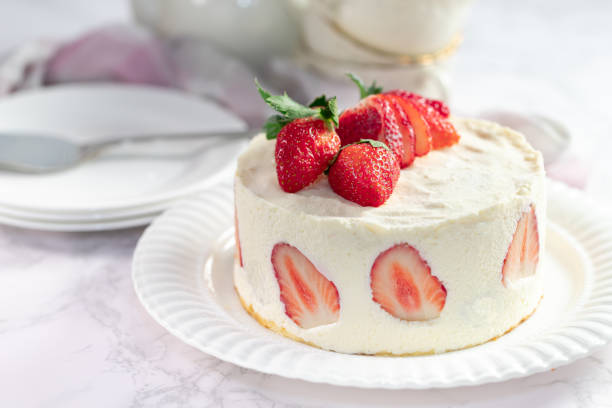 istock Delicious cheesecake with fresh strawberries without baking on a marble stone table 1294704264