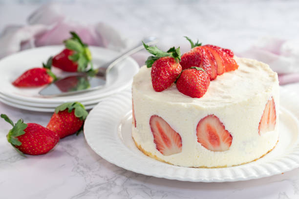 istock Delicious cheesecake with fresh strawberries without baking on a marble stone table 1294704293