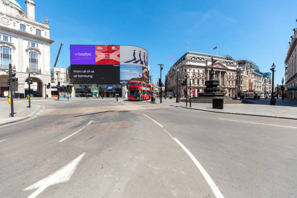 istock Empty Piccadilly circus in London during lockdown, one red double decker bus only on the street 1294705410