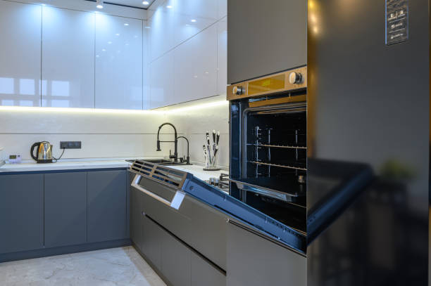 istock Luxury gray modern kitchen interior, oven's door opened 1294708835