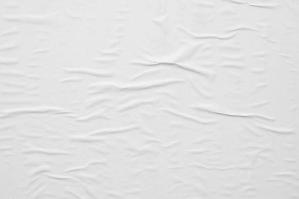 istock Blank white crumpled and creased paper poster texture background 1294710761