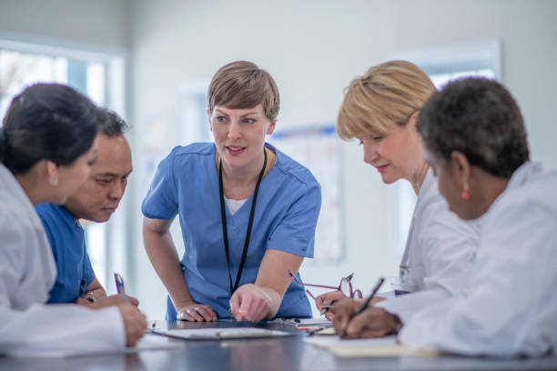 istock Multi ethnic group of doctors meeting 1294710967