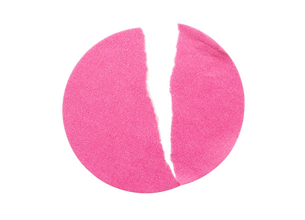 istock Blank pink round adhesive paper sticker label isolated on white background 1294711069