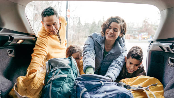 istock Family loading  a car trunk before the road trip 1294711164