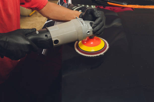 istock Hands with Auto polisher. Car repair service. 1294711436
