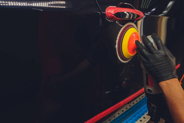 istock Hands with Auto polisher. Car repair service. 1294711450