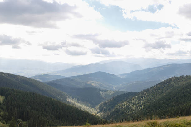 istock Summer landscape in mountains and the dark blue sky with clouds 1294716911