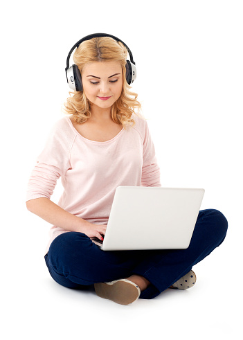 Girl with headphones and laptop