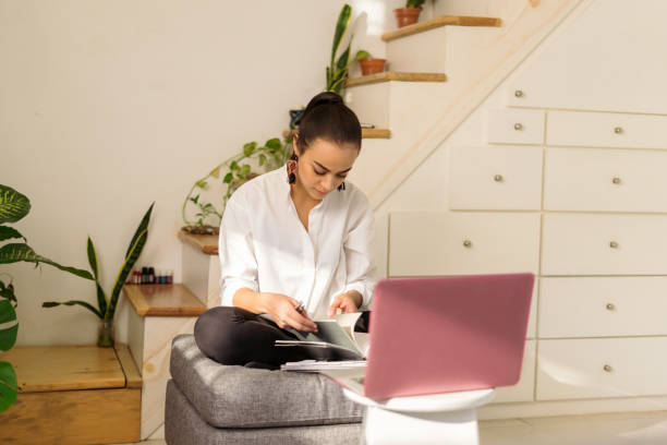 istock University student having online school class at home 1294723180