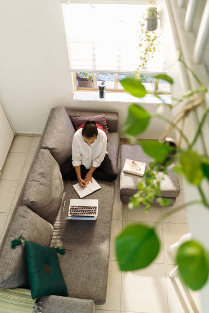 istock Smart millennial woman studying and working at home 1294723217