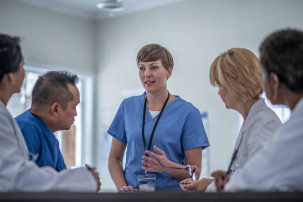 istock Multi ethnic group of doctors meeting 1294723997