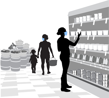 People strolling through a grocery store with medical masks