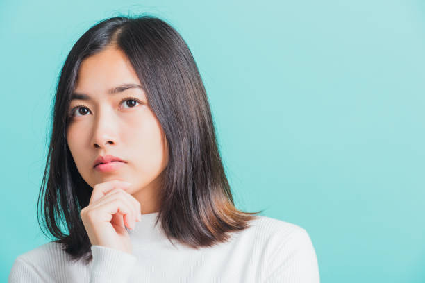 istock woman hand near the face and thinking 1294738883