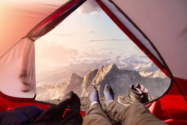 istock Camping inside a Tent with beautiful rocky mountains 1294741665