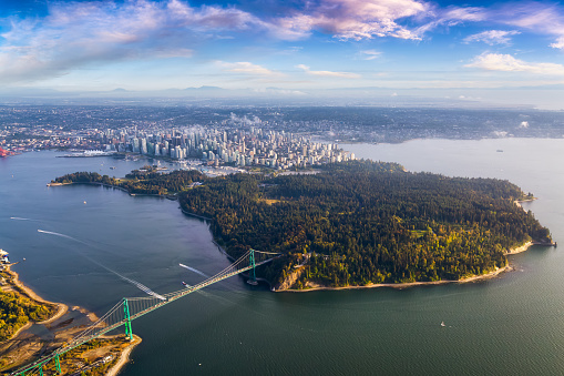Beautiful Aerial View of Lions Gate Bridge, Stanley Park and Vancouver Downtown, British Columbia, Canada. Colorful Sunrise Artistic Render