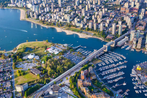 Aerial Photography of False Creek in Downtown Vancouver Aerial Photography of False Creek in Downtown Vancouver, British Columbia (BC), Canada, on a sunny sunset. Modern City on the Pacific West Coast. false creek stock pictures, royalty-free photos & images