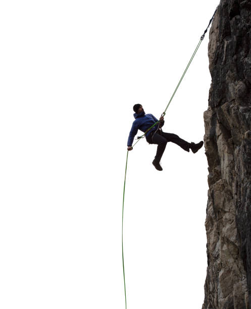 ロッククライミングマンラペリングの壮大な冒険極端なスポーツコンポジット - rappelling ストックフォトと画像