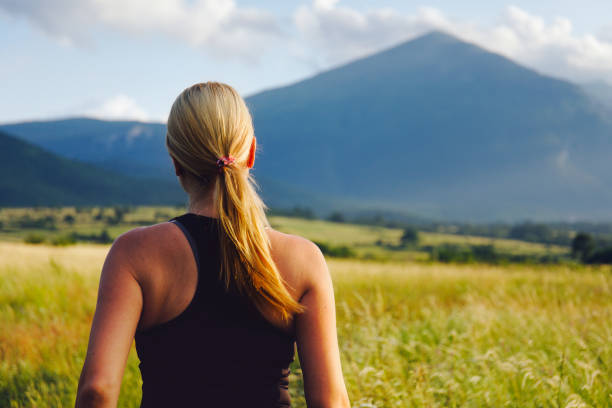 istock Young woman athlete on a trail in nature 1294743706