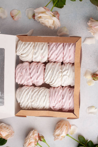 istock Preparing care package, seasonal gift box with marshmallow, roses. Personalized eco friendly basket for winter holidays. Concept valentine day. Top view, flat lay 1294750277