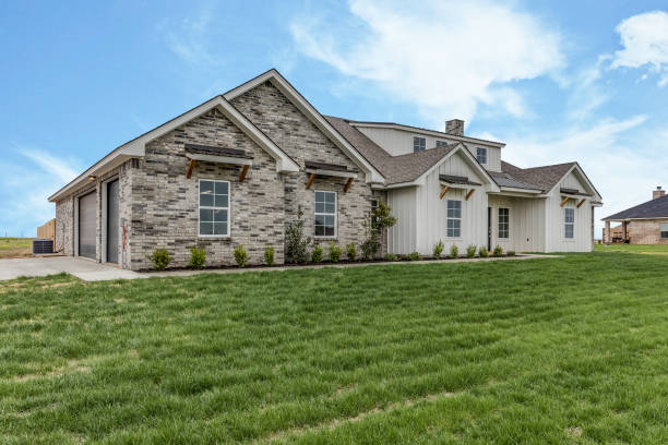 istock Texas home with brick and board and battin 1294760297