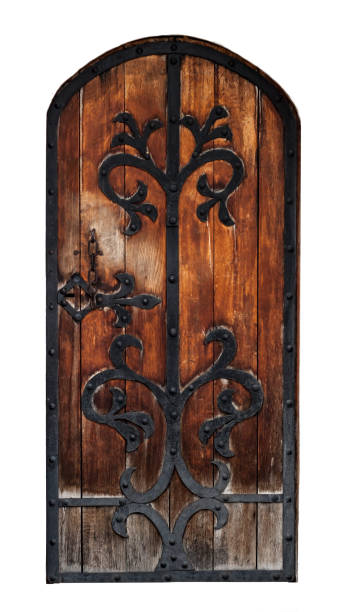 istock Ancient wooden door with wrought iron edging, white isolated 1294771194