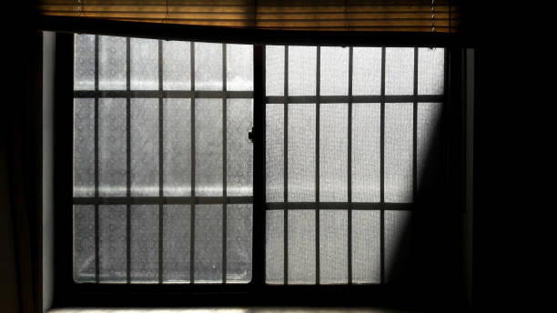 istock Patterned old glass windows, the morning sun shines in 1294776414