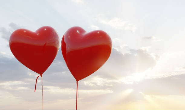 istock Two heart balloons at sunset 1294779546