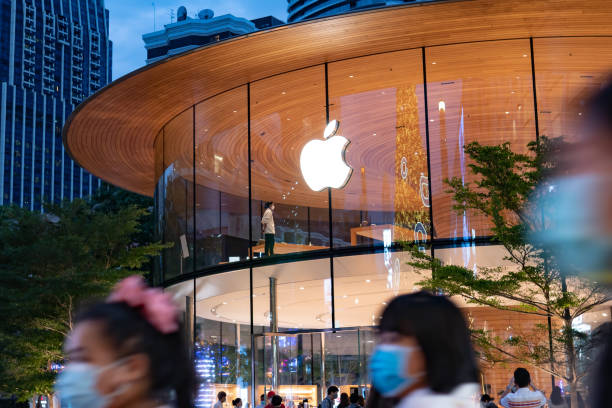 Apple store in Thailand in 2020 Bangkok, Thailand - December 2, 2020: People visiting Apple store with face mask. apple computer stock pictures, royalty-free photos & images