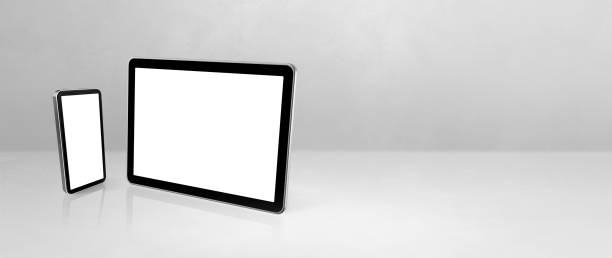istock Mobile phone and digital tablet pc on white concrete office desk. Background banner 1294784124