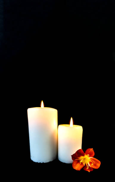 istock Candle on a black background, postcard, Flat Lai on death and funeral 1294785117