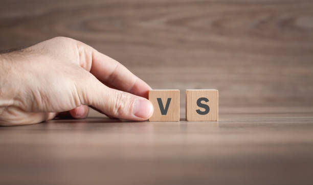 istock Male hand showing VS word on wooden cube. 1294785569