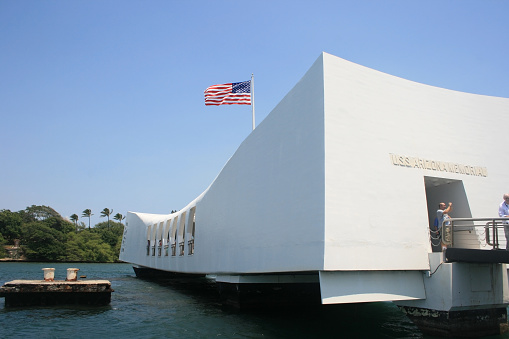 Pearl Harbor, Hawaii, USA - April 28, 2008: The USS Arizona Memorial in Pearl Harbor, Oahu, Hawaii view from a shuttle boat arriving at the pier.