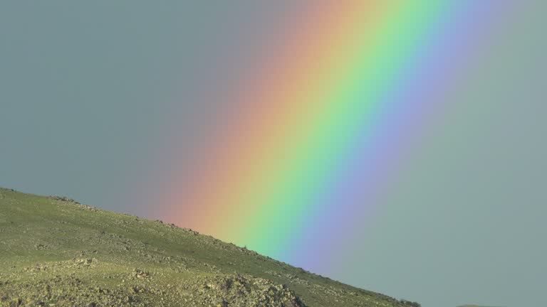 Colorful Rainbow in Vast Treeless Meadow