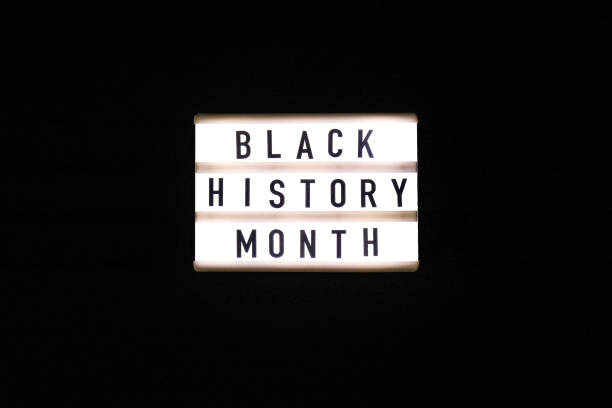 istock Lightbox with text BLACK HISTORY MONTH on dark black background. Message historical event 1294796421