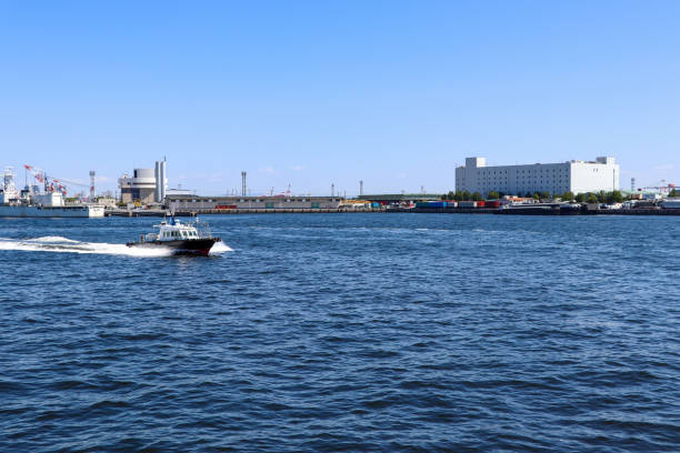 istock Small boat patrolling in the harbor 1294796744