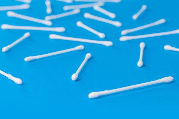 istock Cotton buds attached to a plastic rod on a blue background 1294797862