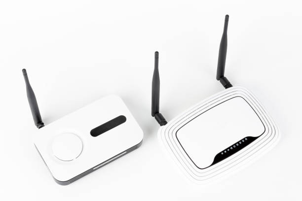 istock Two Wi-Fi routers, wireless devices with one and two antennas on white background. 1294798762