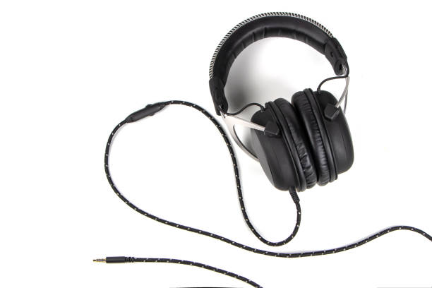 istock Headphones. Black headphones isolated on white background 1294800639