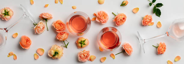 istock Rose wine and roses on white background 1294801601