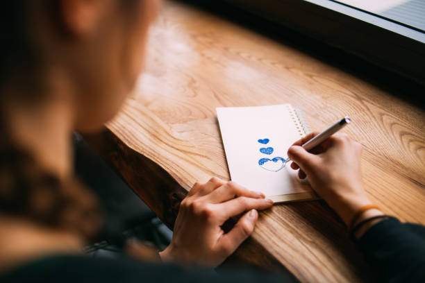 Cute Woman Preparing a Valentine Card