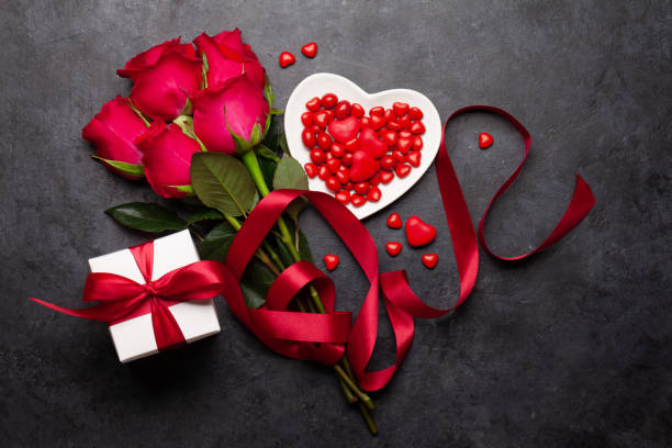 istock Valentines day greeting card with rose flowers and gift box 1294808025