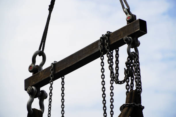 istock Crane boom with isolated hook, blue sky background,Elements of crane: hook, loop, chain, connecting parts 1294809588