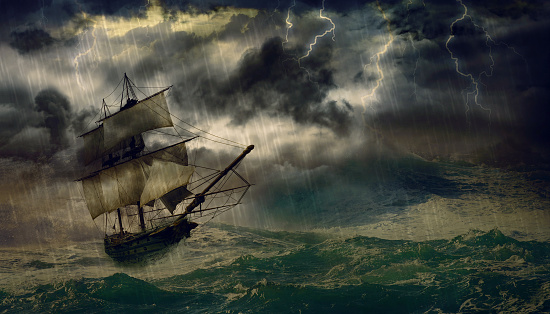 A ship in the sea or ocean that is in danger due to the storm that creates threatening waves.