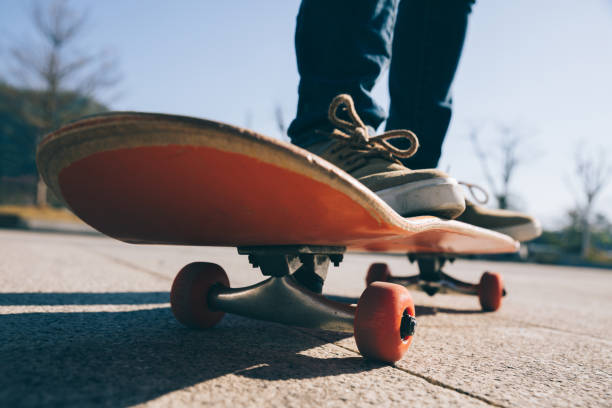 istock Skateboarder skateboarding outdoors on sunny morning 1294813877