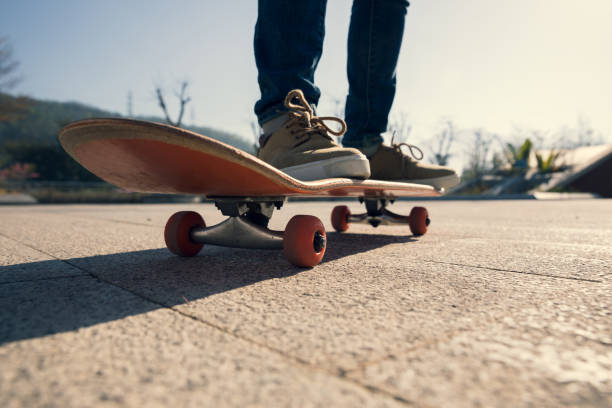 istock Skateboarder skateboarding outdoors on sunny morning 1294814072