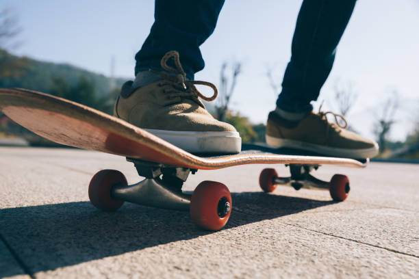 istock Skateboarder skateboarding outdoors on sunny morning 1294814115